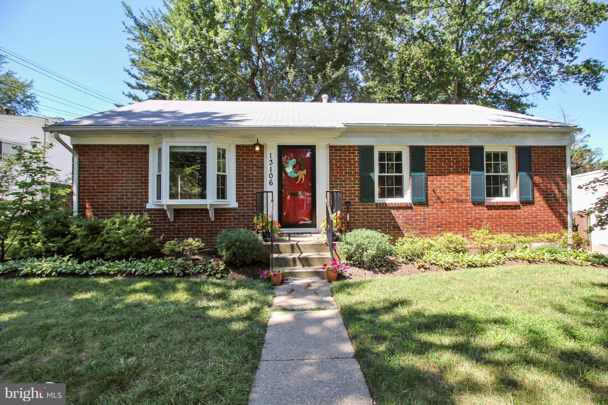 13106 Estelle Road Silver Spring, MD 20906 - Photo 1 of 21 a front view of a house with garden