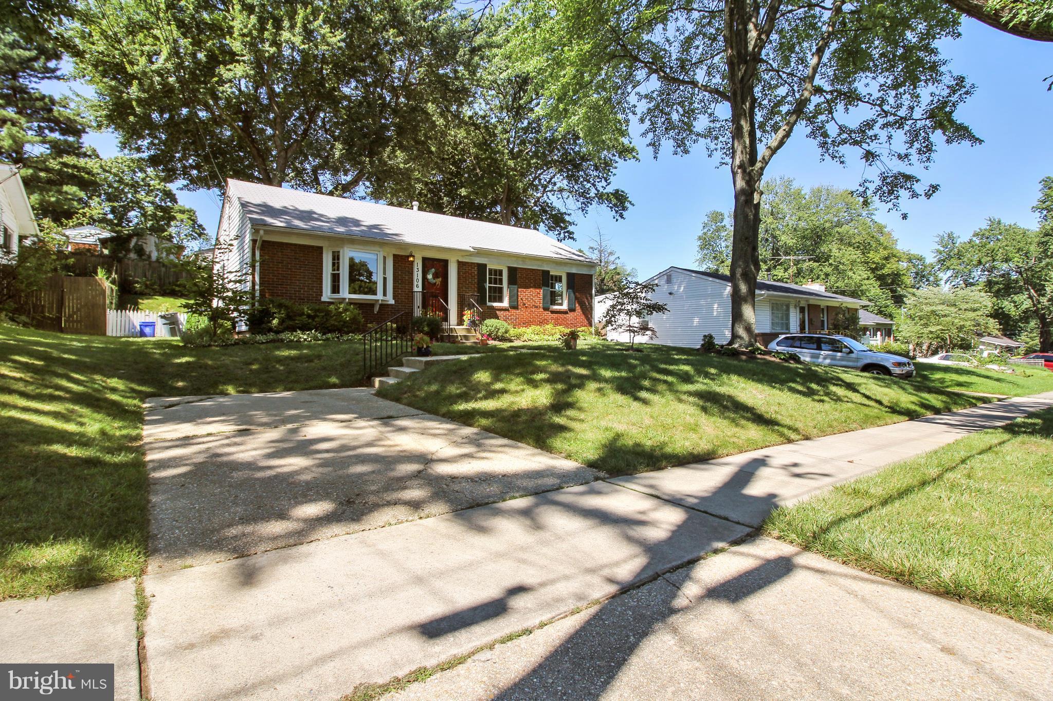 13106 Estelle Road Silver Spring, MD 20906 - Photo 2 of 21 a front view of a house with a yard