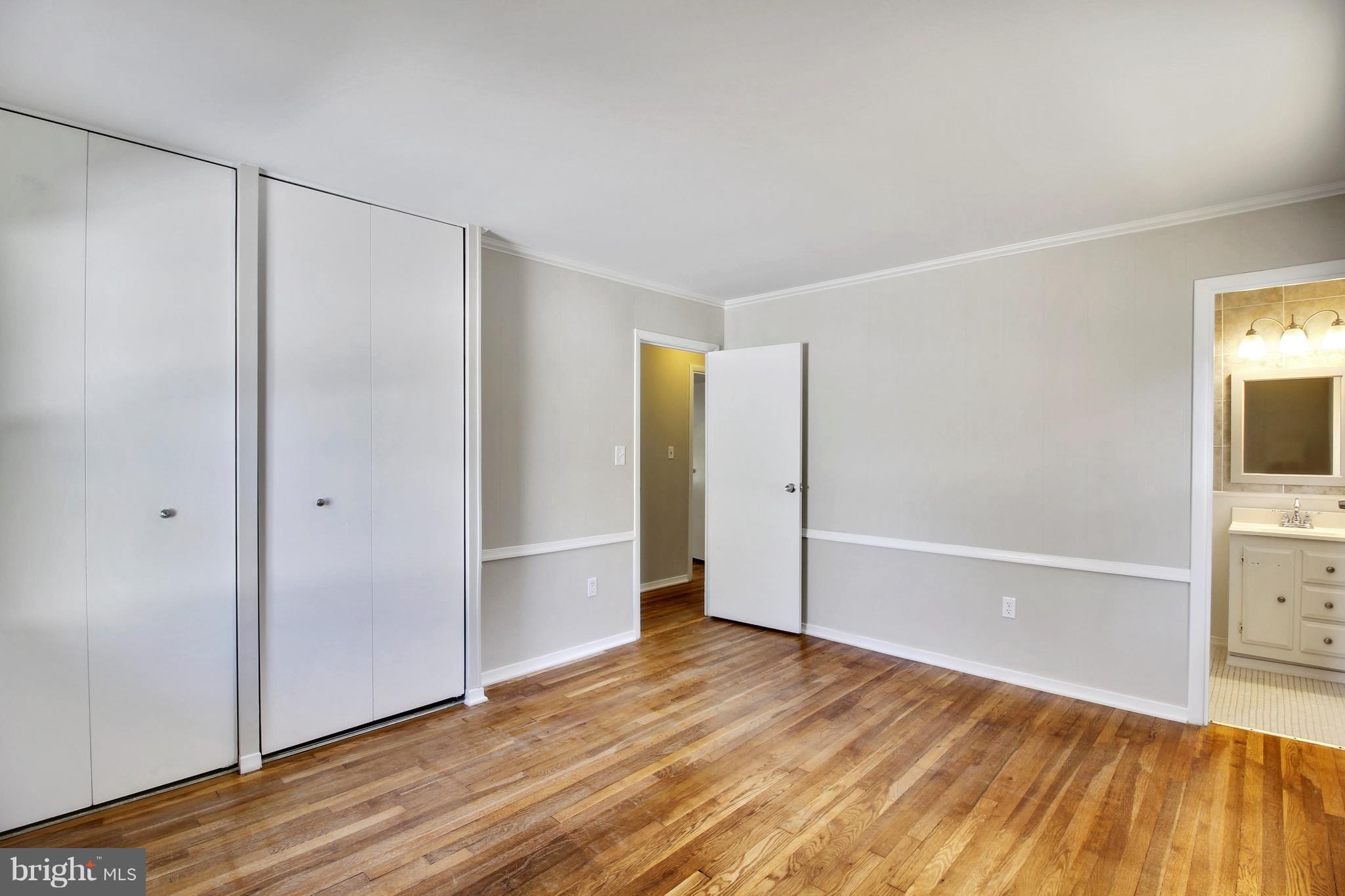 13106 Estelle Road Silver Spring, MD 20906 - Photo 12 of 21 a view of an empty room with wooden floor and closet
