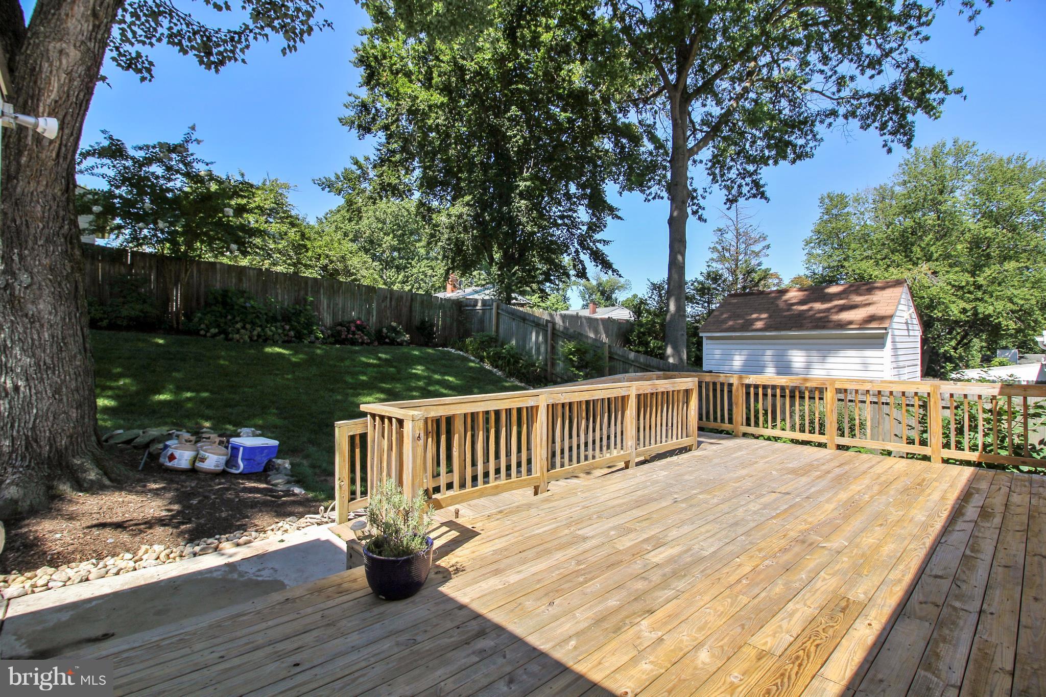 13106 Estelle Road Silver Spring, MD 20906 - Photo 18 of 21 a view of a deck with wooden floor and seating space