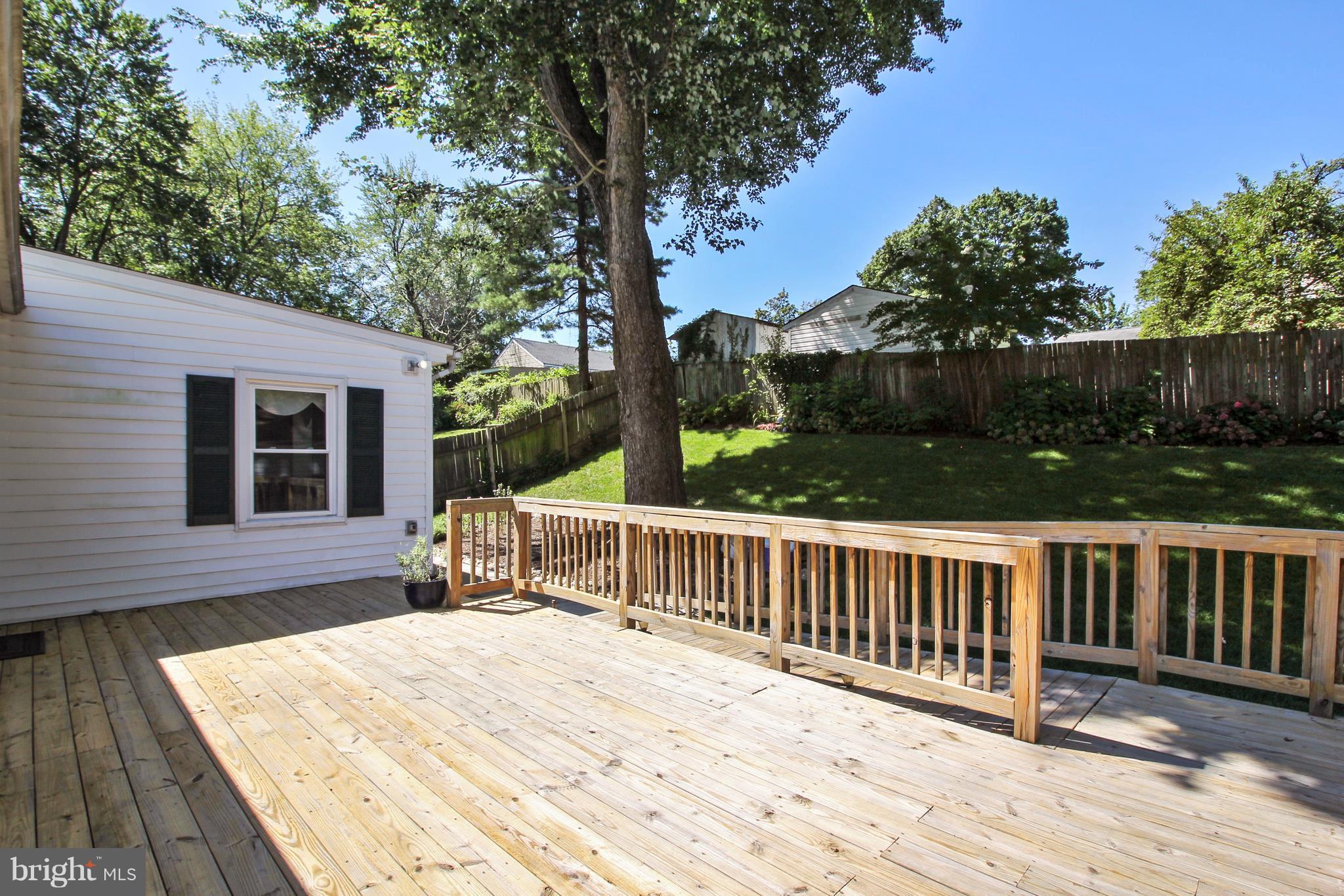 13106 Estelle Road Silver Spring, MD 20906 - Photo 19 of 21 a view of backyard with deck and outdoor seating