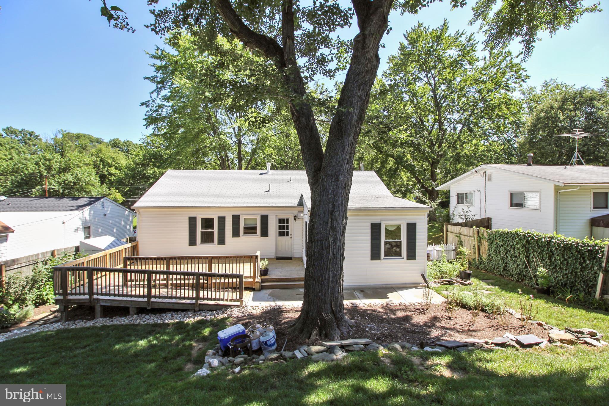 13106 Estelle Road Silver Spring, MD 20906 - Photo 20 of 21 a view of a house with a backyard