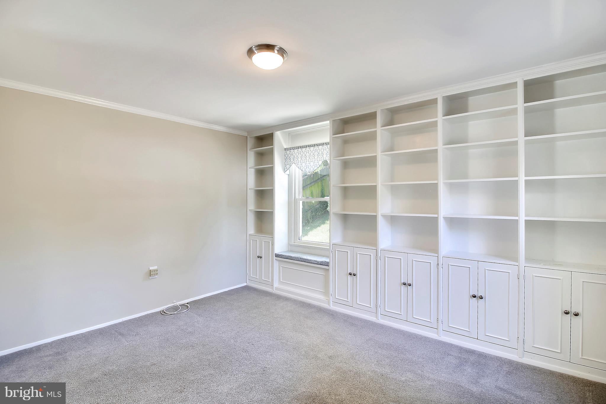 13106 Estelle Road Silver Spring, MD 20906 - Photo 10 of 21 a view of an empty room with a window and cabinet