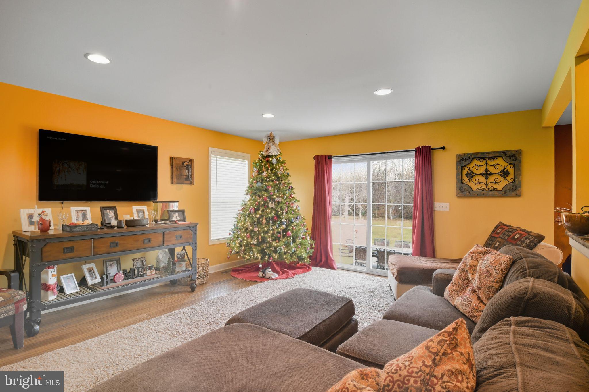 24712 Tribbett Circle Ridgely, MD 21660 - Photo 12 of 37 a living room with furniture and a flat screen tv