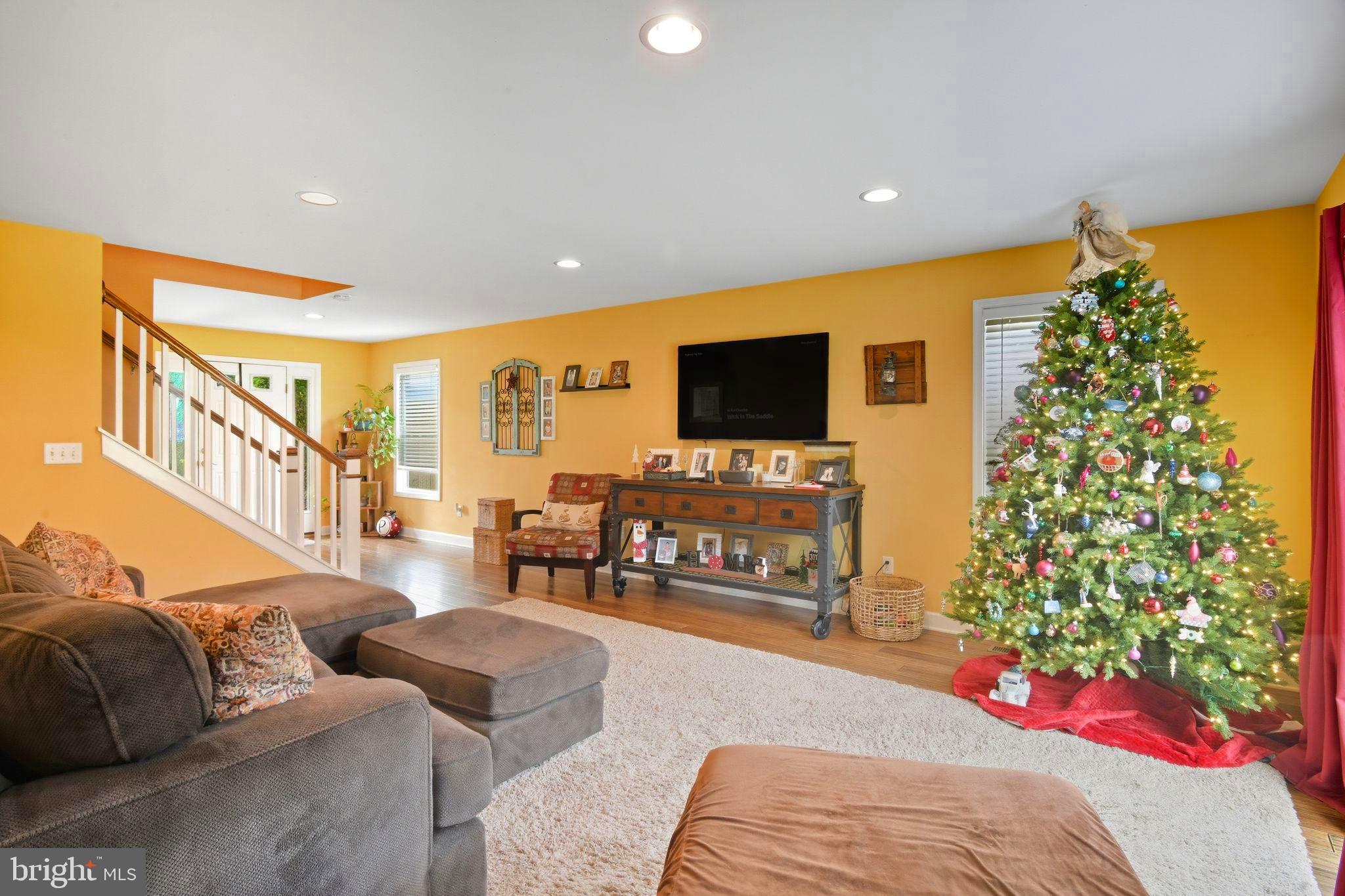 24712 Tribbett Circle Ridgely, MD 21660 - Photo 14 of 37 a living room with furniture and a flat screen tv