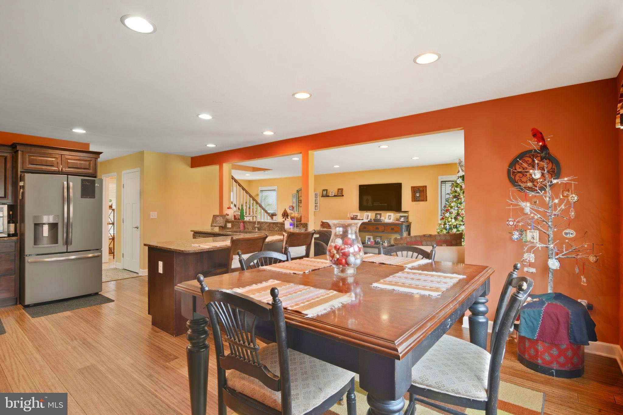 24712 Tribbett Circle Ridgely, MD 21660 - Photo 22 of 37 a view of a dining room with furniture window and wooden floor