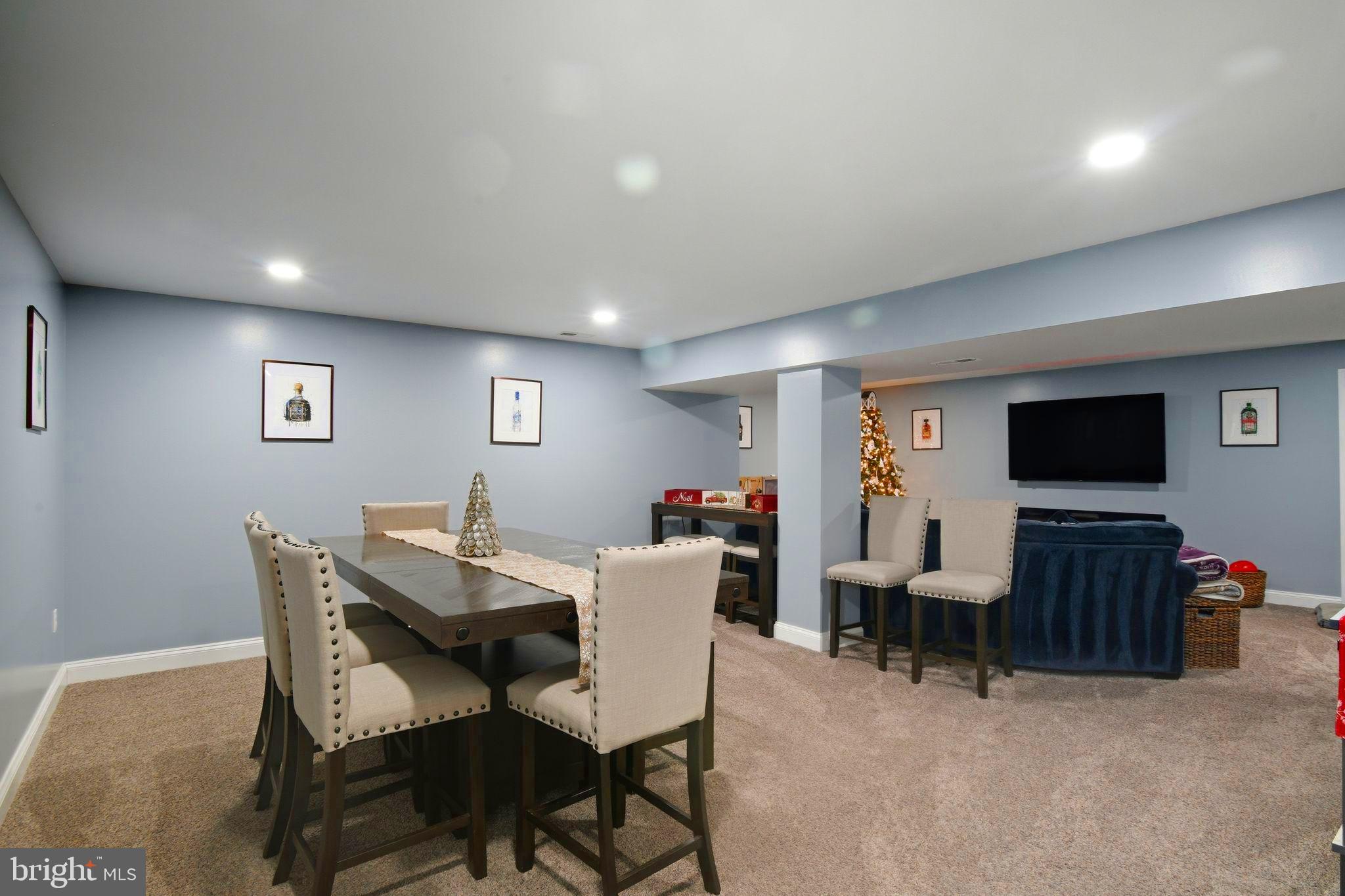 24712 Tribbett Circle Ridgely, MD 21660 - Photo 24 of 37 a view of a livingroom with furniture and a flat screen tv