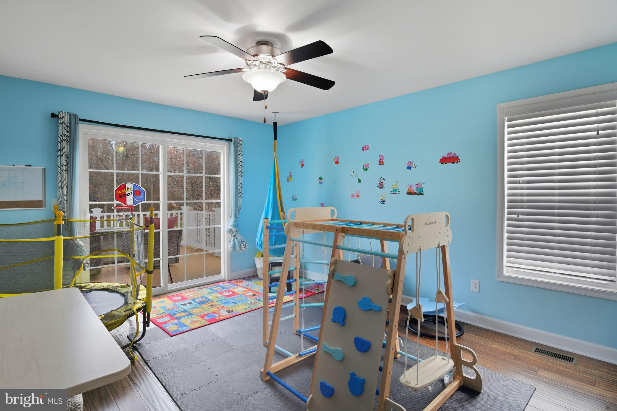 24712 Tribbett Circle Ridgely, MD 21660 - Photo 26 of 37 a children room with furniture wooden floor and windows