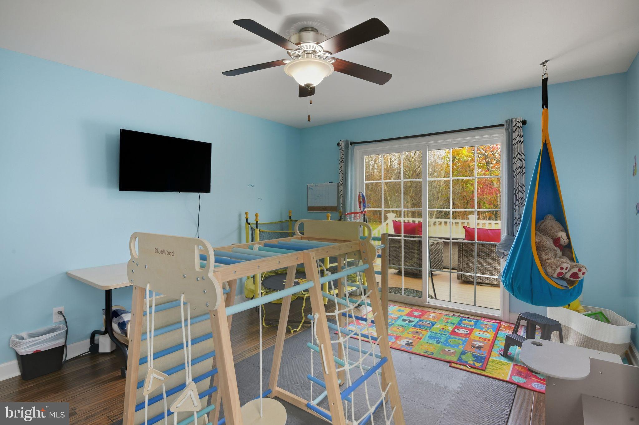 24712 Tribbett Circle Ridgely, MD 21660 - Photo 27 of 37 a view of a livingroom with furniture and a flat screen tv