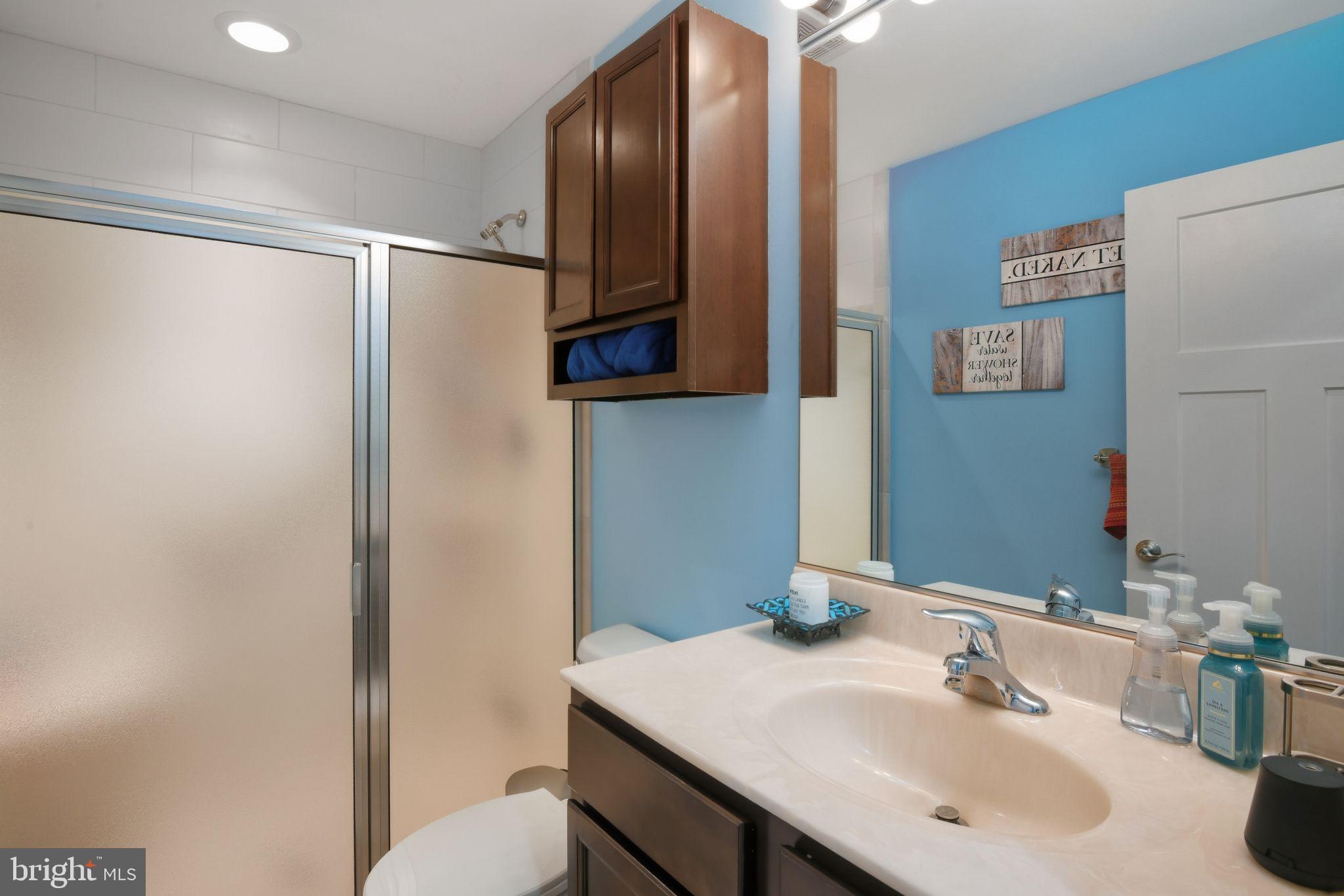 24712 Tribbett Circle Ridgely, MD 21660 - Photo 33 of 37 a bathroom with a sink and a mirror