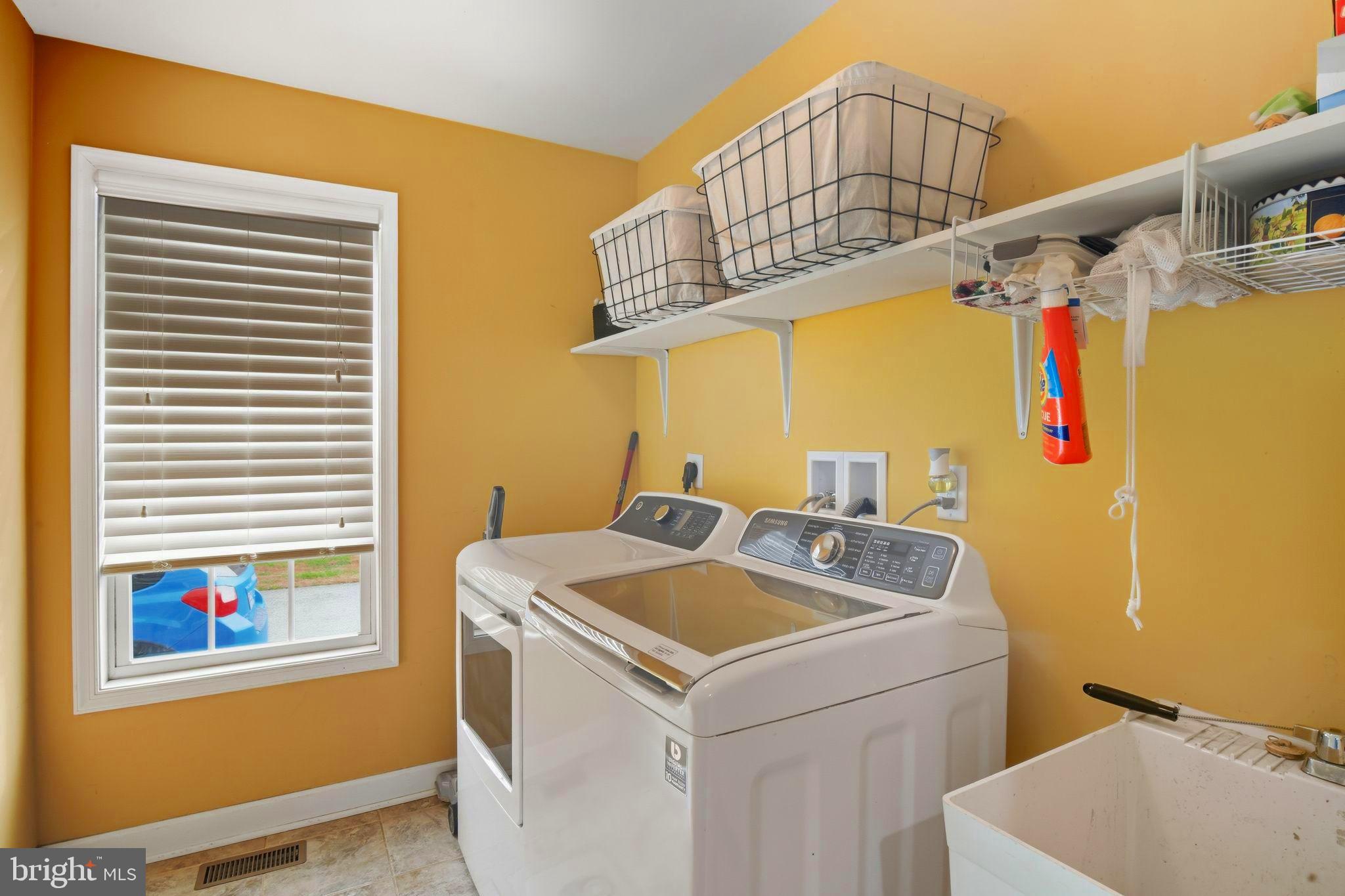 24712 Tribbett Circle Ridgely, MD 21660 - Photo 36 of 37 a utility room with dryer and washer