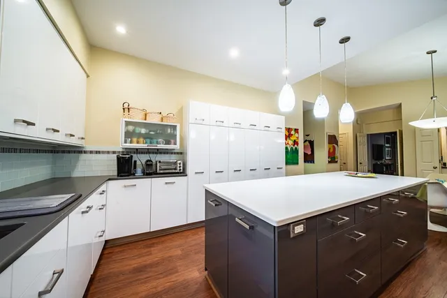 a kitchen with a stove and a sink
