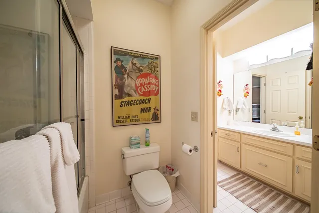 a bathroom with a walk in closet and a window