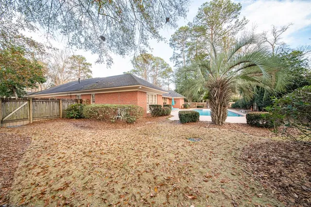 a backyard of a house with lots of green space