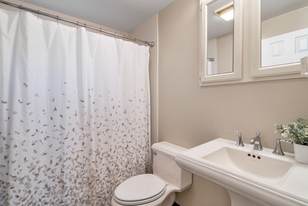 21 Fishermans Cove Road Wareham, MA 02532 - Photo 12 of 34 a bathroom with a sink a toilet and a mirror