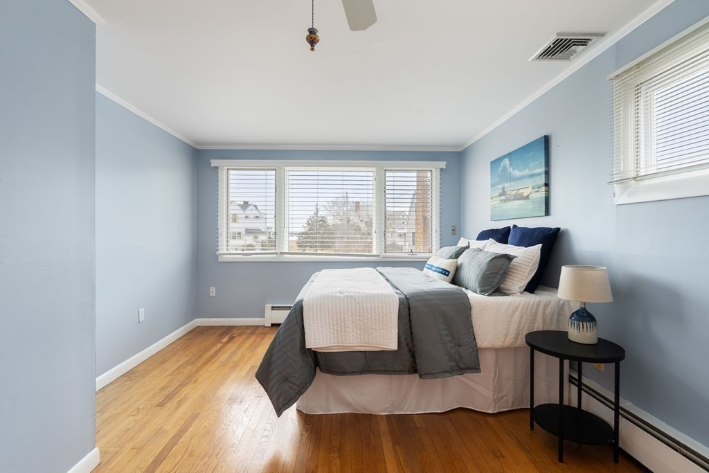 21 Fishermans Cove Road Wareham, MA 02532 - Photo 14 of 34 a bedroom with a bed and wooden floor