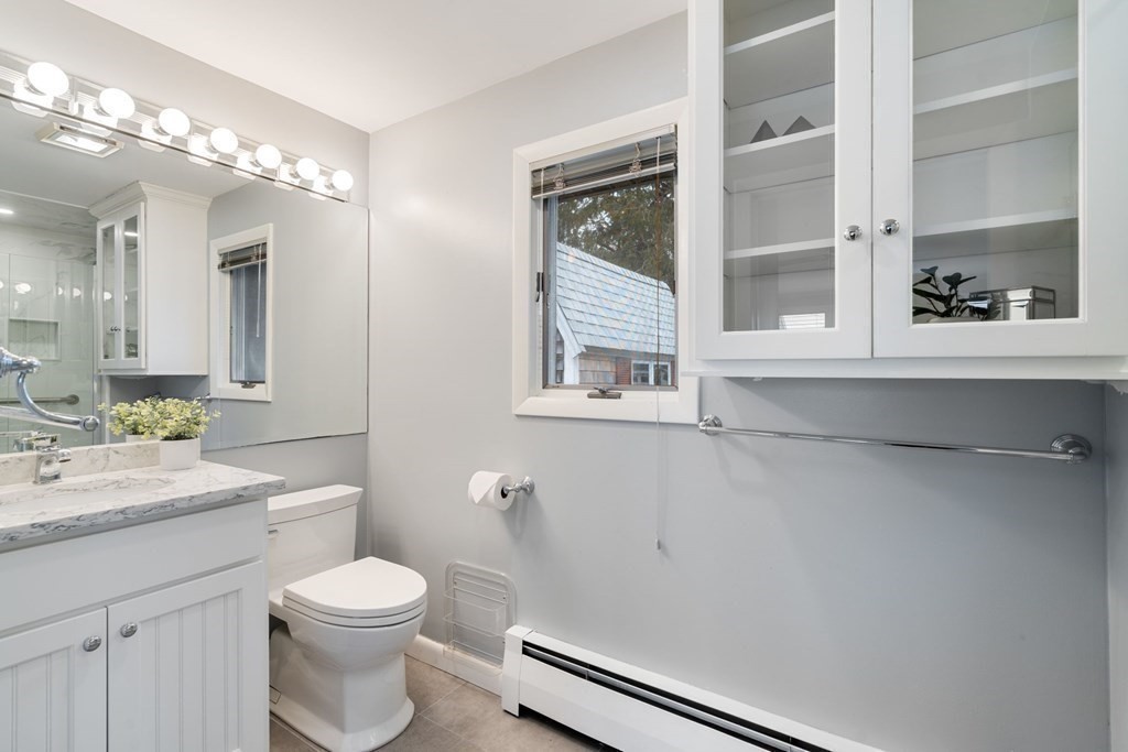 21 Fishermans Cove Road Wareham, MA 02532 - Photo 16 of 34 a bathroom with a toilet sink and mirror