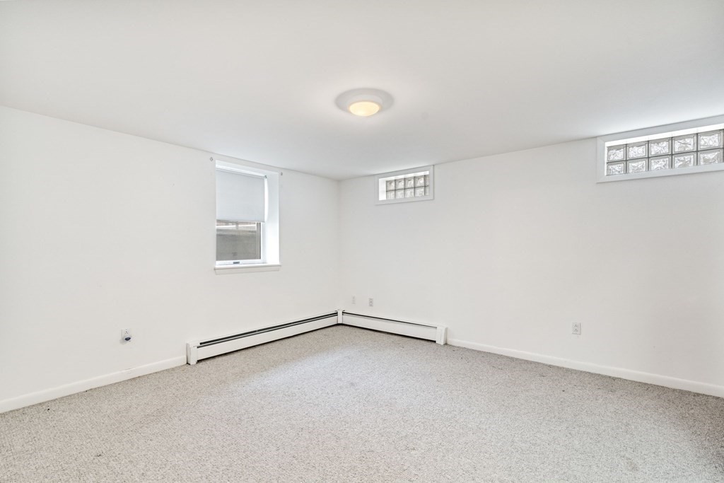 21 Fishermans Cove Road Wareham, MA 02532 - Photo 22 of 34 an empty room with a empty space and windows
