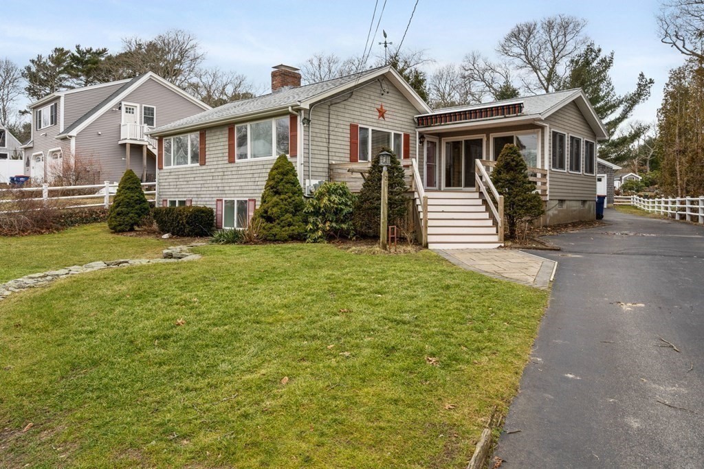 21 Fishermans Cove Road Wareham, MA 02532 - Photo 24 of 34 a front view of a house with yard and green space
