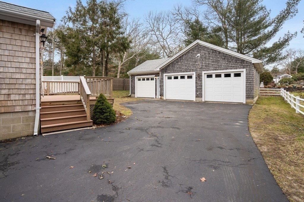 21 Fishermans Cove Road Wareham, MA 02532 - Photo 25 of 34 a view of a house with a yard and large tree
