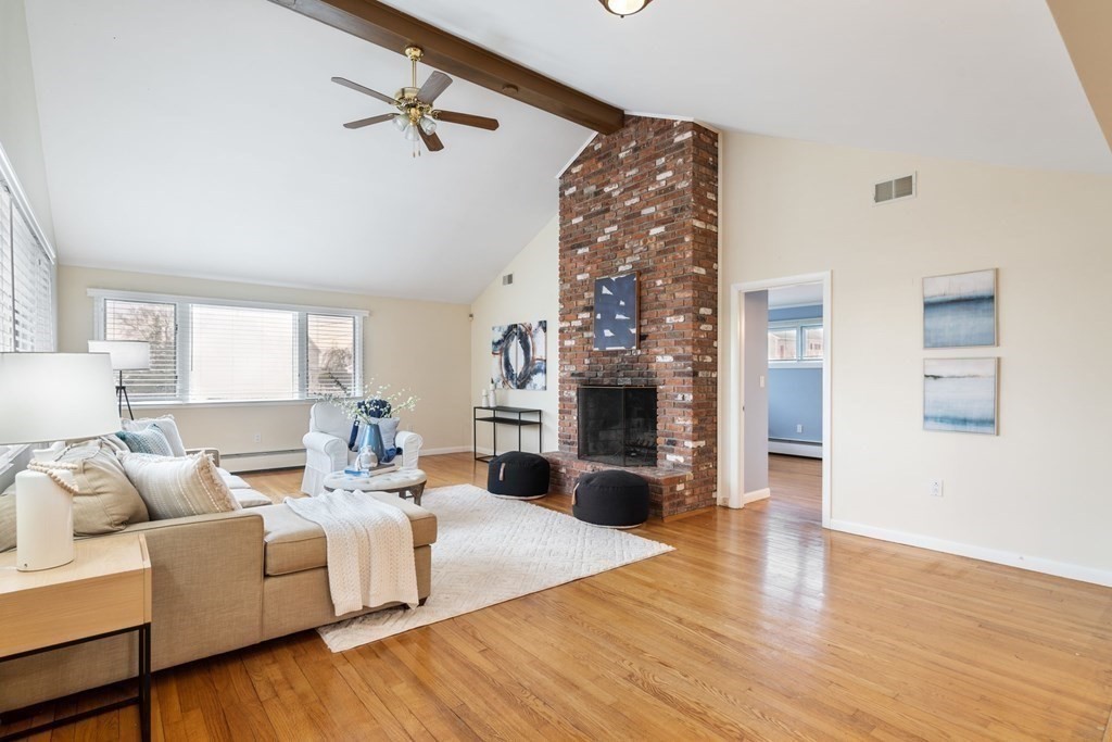 21 Fishermans Cove Road Wareham, MA 02532 - Photo 3 of 34 a living room with fireplace furniture and a wooden floor