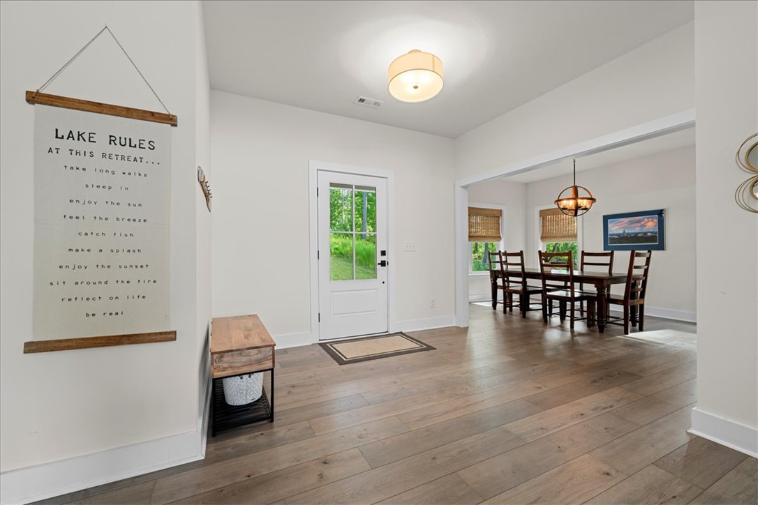 545 Peninsula Road West Union, SC 29696 - Photo 7 of 49 Enter into a bright living space featuring natural light and beautiful hardwood floors.