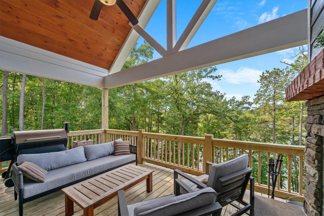 545 Peninsula Road West Union, SC 29696 - Photo 8 of 49 This spacious covered deck offers serene wooded views, perfect for peaceful outdoor enjoyment.