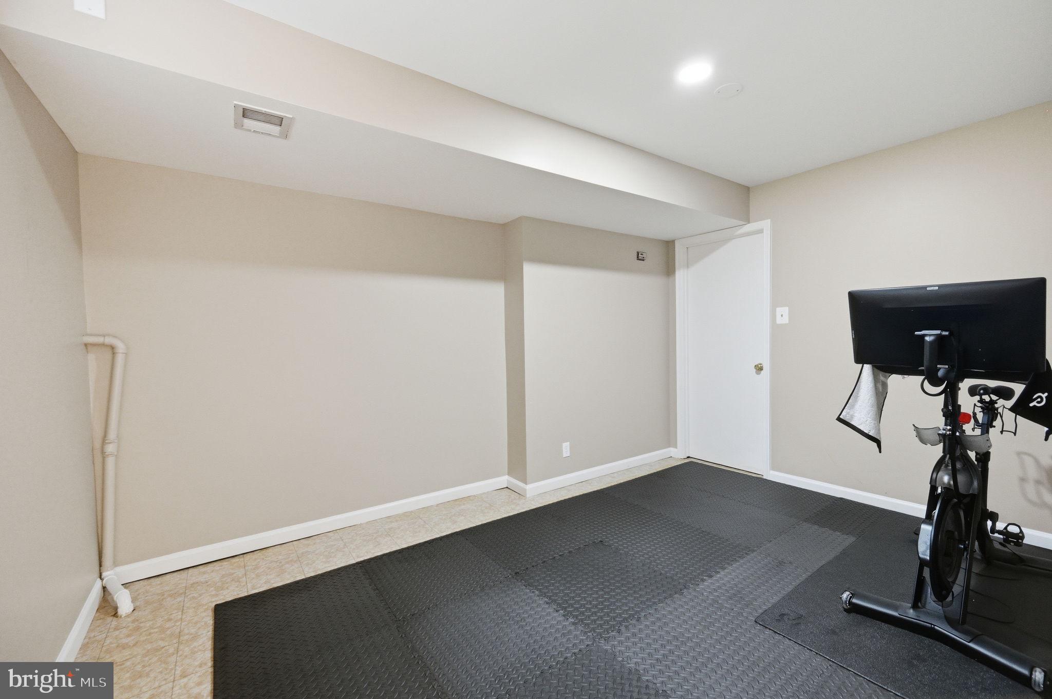 2506 Pinoak Lane Reston, VA 20191 - Photo 26 of 33 a view of a room with gym equipment