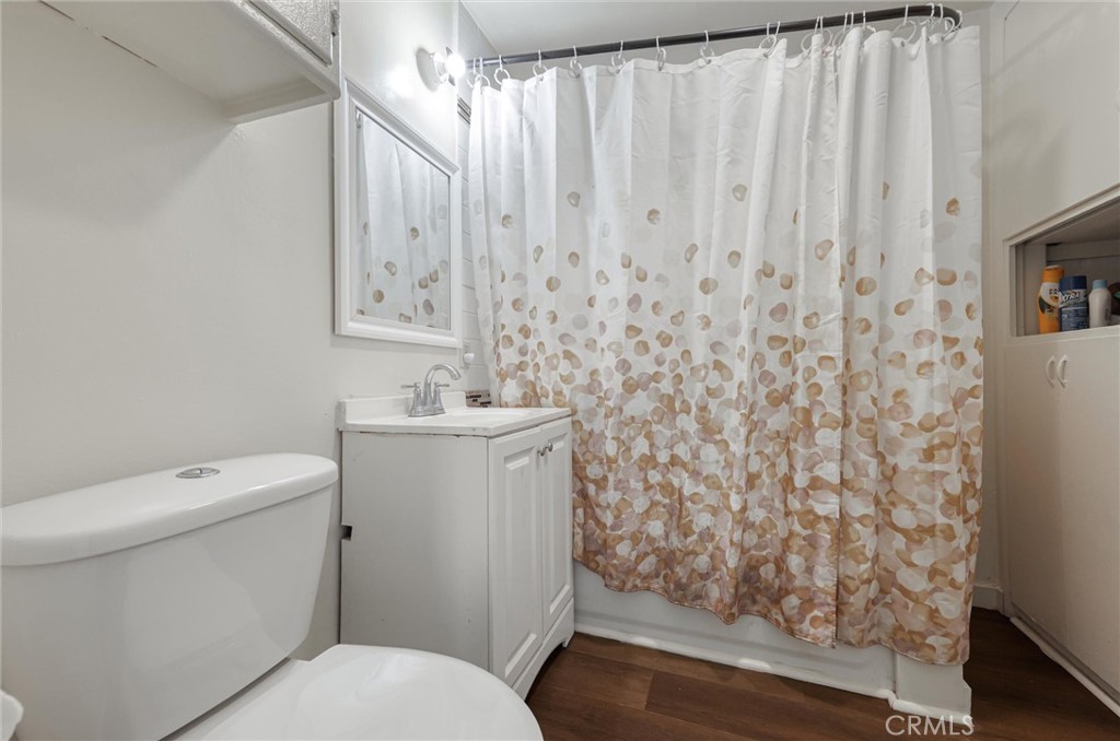 21719 Neptune Avenue Carson, CA 90745 - Photo 14 of 15 a bathroom with a toilet sink and shower