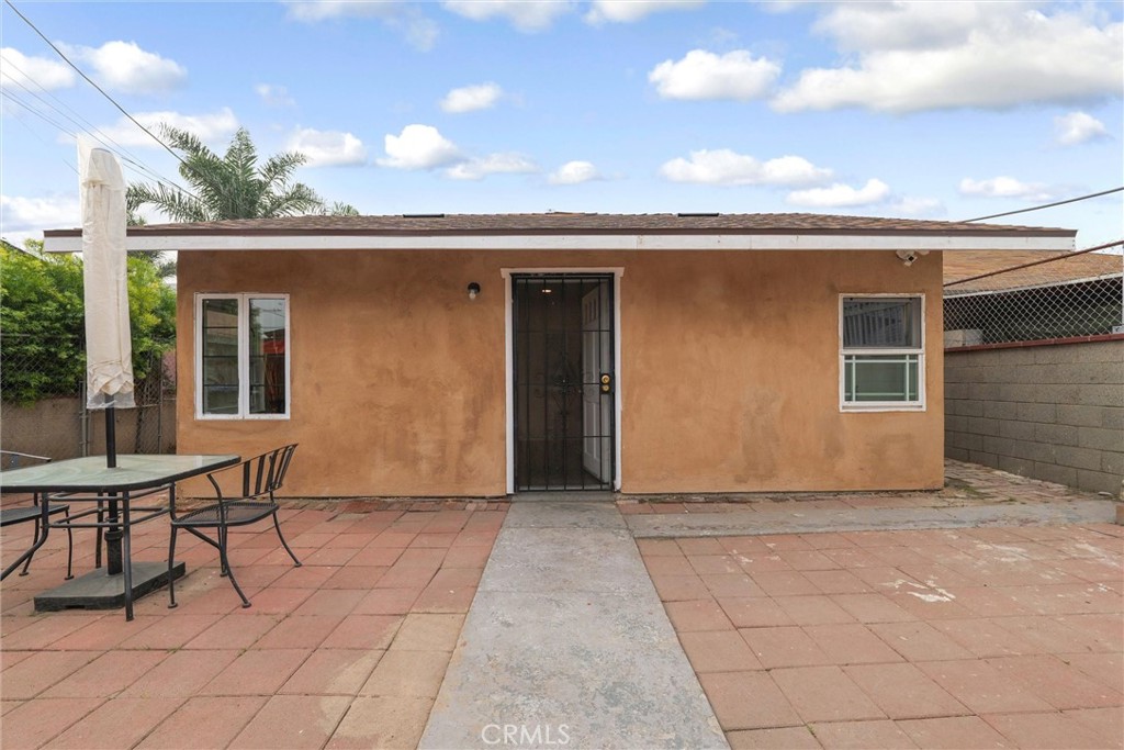 21719 Neptune Avenue Carson, CA 90745 - Photo 3 of 15 a view of a porch with furniture and a gate