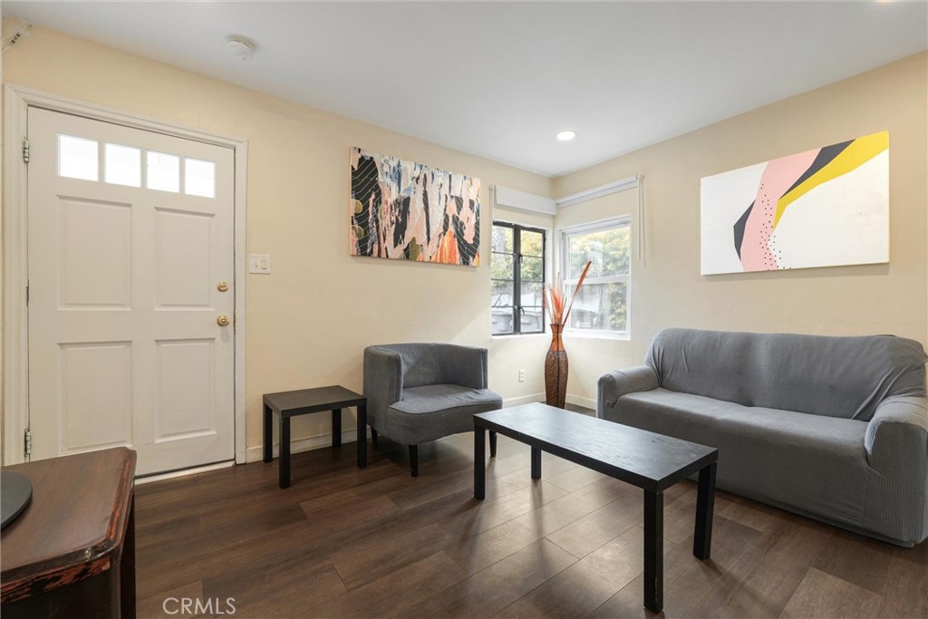 21719 Neptune Avenue Carson, CA 90745 - Photo 5 of 15 a living room with furniture and a wooden floor