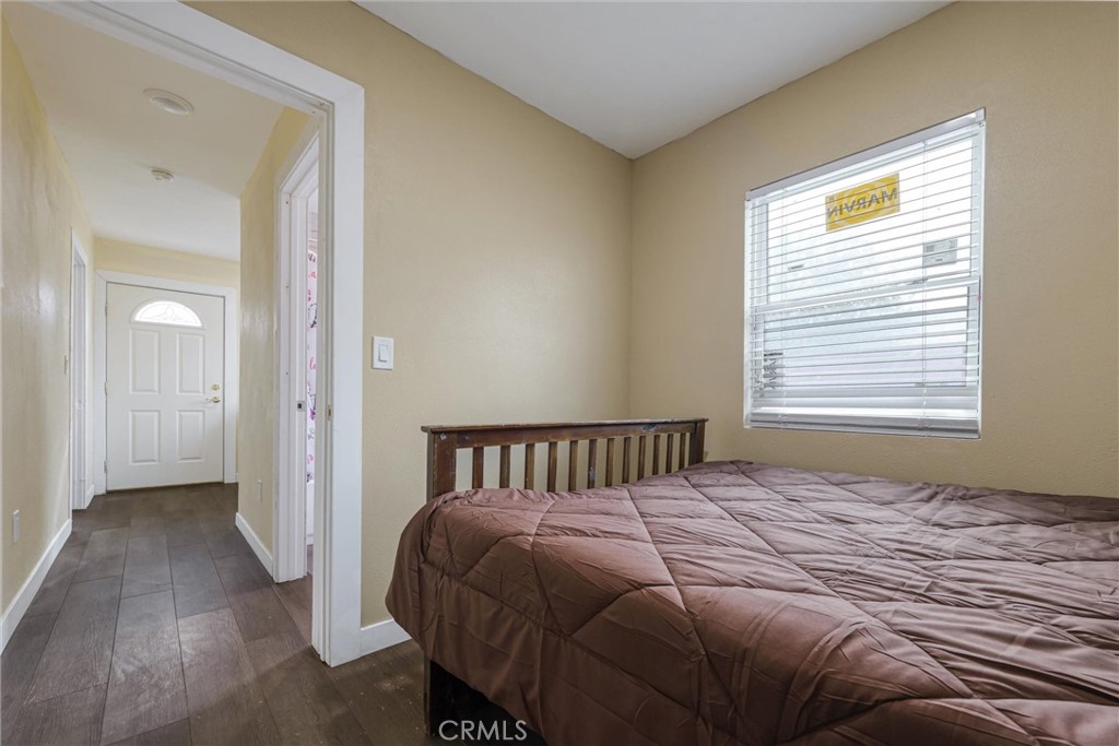 21719 Neptune Avenue Carson, CA 90745 - Photo 10 of 15 a bedroom with a bed and a window