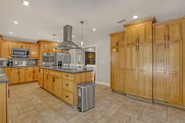 a living room with furniture a rug and a chandelier