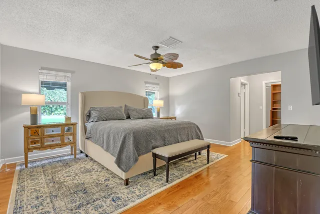 a view of a kitchen with a sink and cabinets
