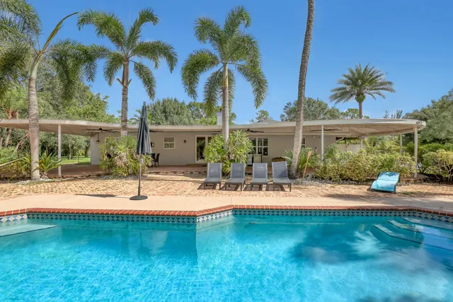 an aerial view of residential building with green space