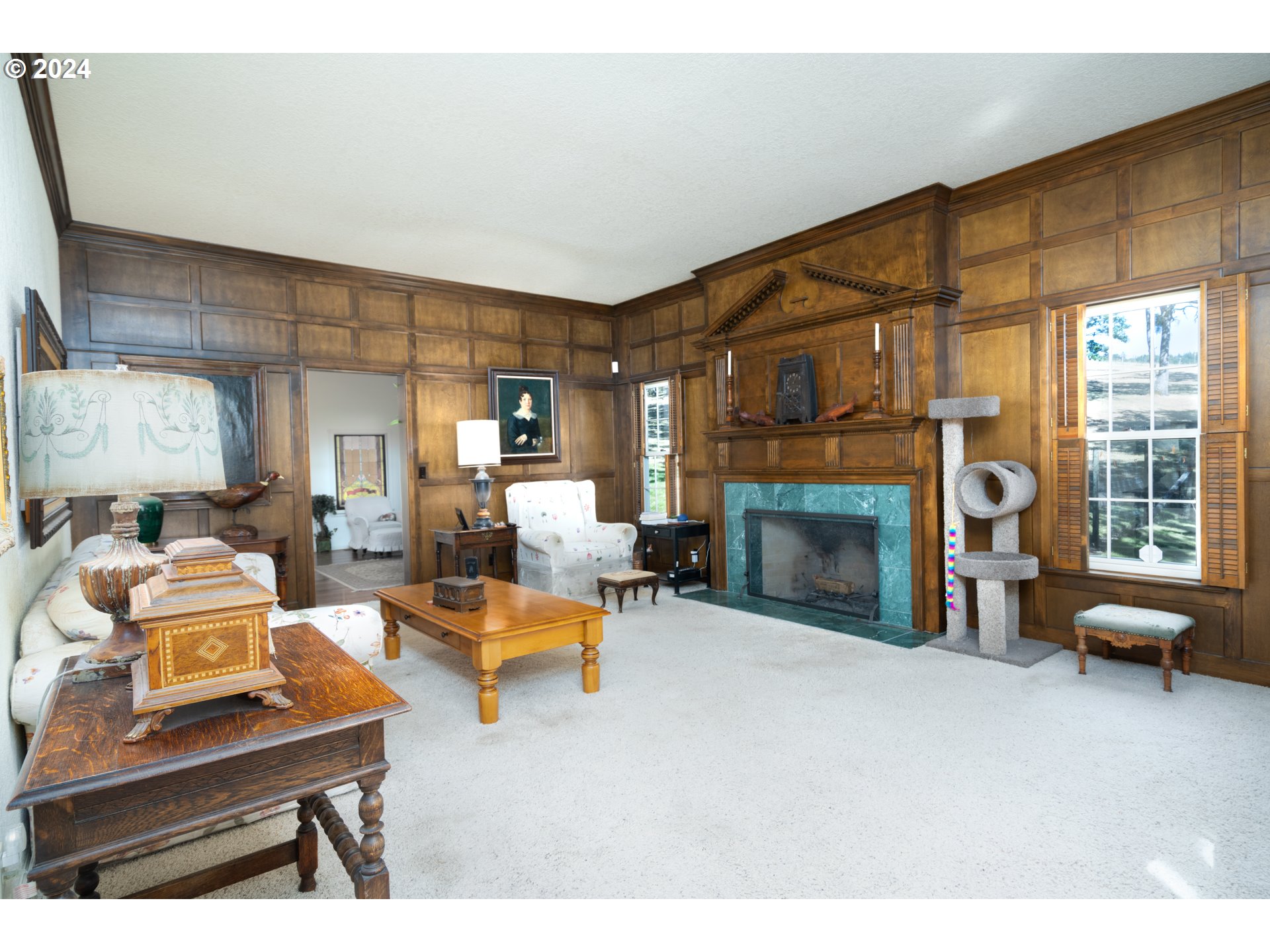 588 South Deer Creek Road Roseburg, OR 97470 - Photo 12 of 45 a living room with furniture a fireplace and a table