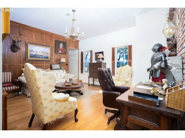 a living room with furniture and chandelier