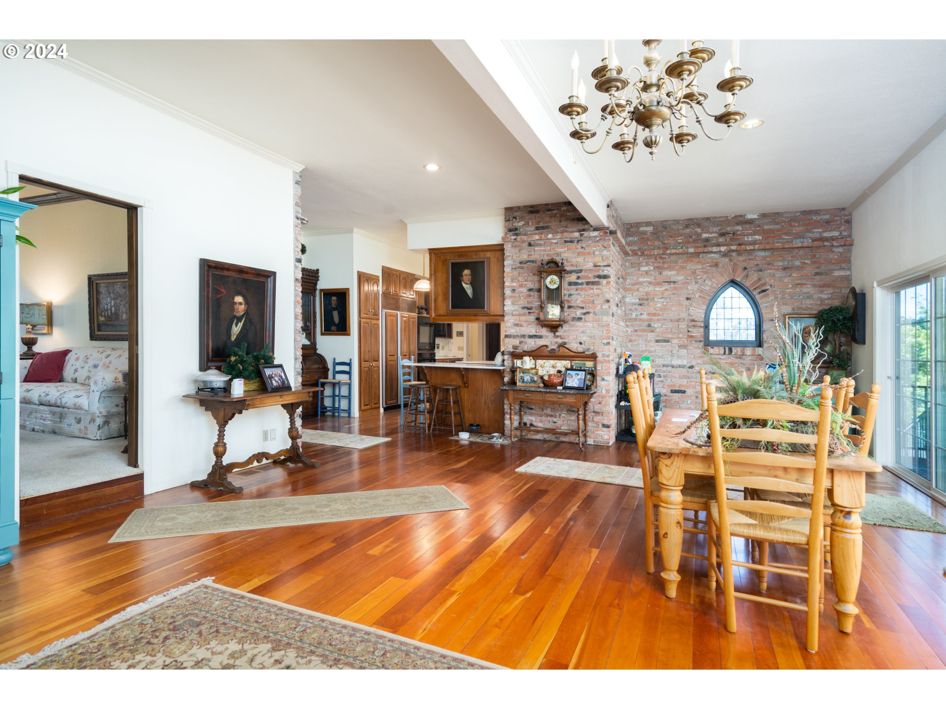 588 South Deer Creek Road Roseburg, OR 97470 - Photo 17 of 45 a living room filled with furniture and a chandelier