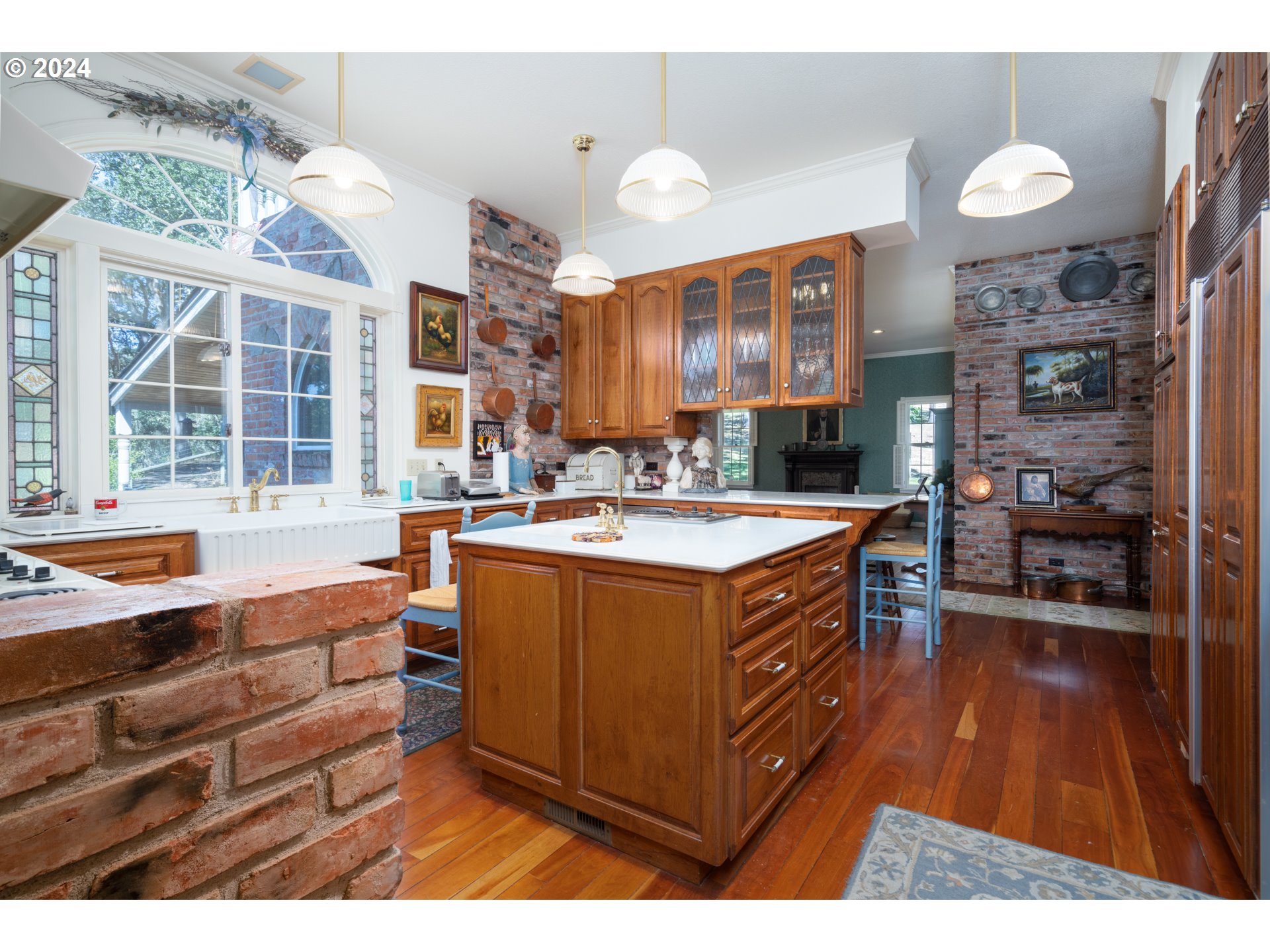 588 South Deer Creek Road Roseburg, OR 97470 - Photo 20 of 45 a kitchen with stainless steel appliances kitchen island granite countertop a sink and a wooden cabinets