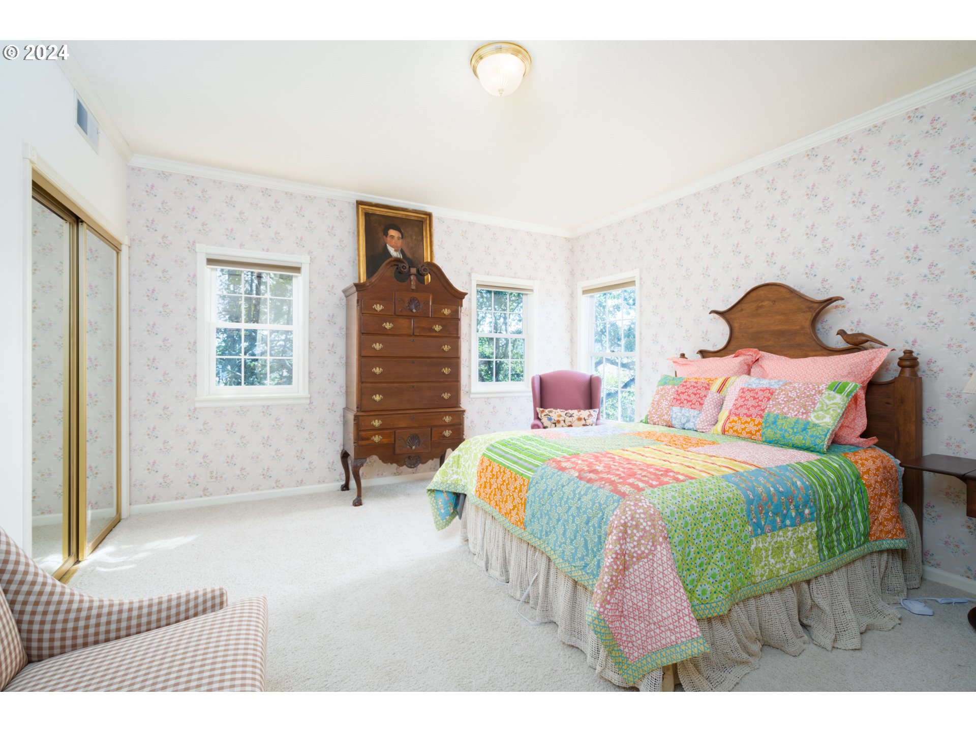 588 South Deer Creek Road Roseburg, OR 97470 - Photo 30 of 45 a bedroom with a bed a dresser and windows