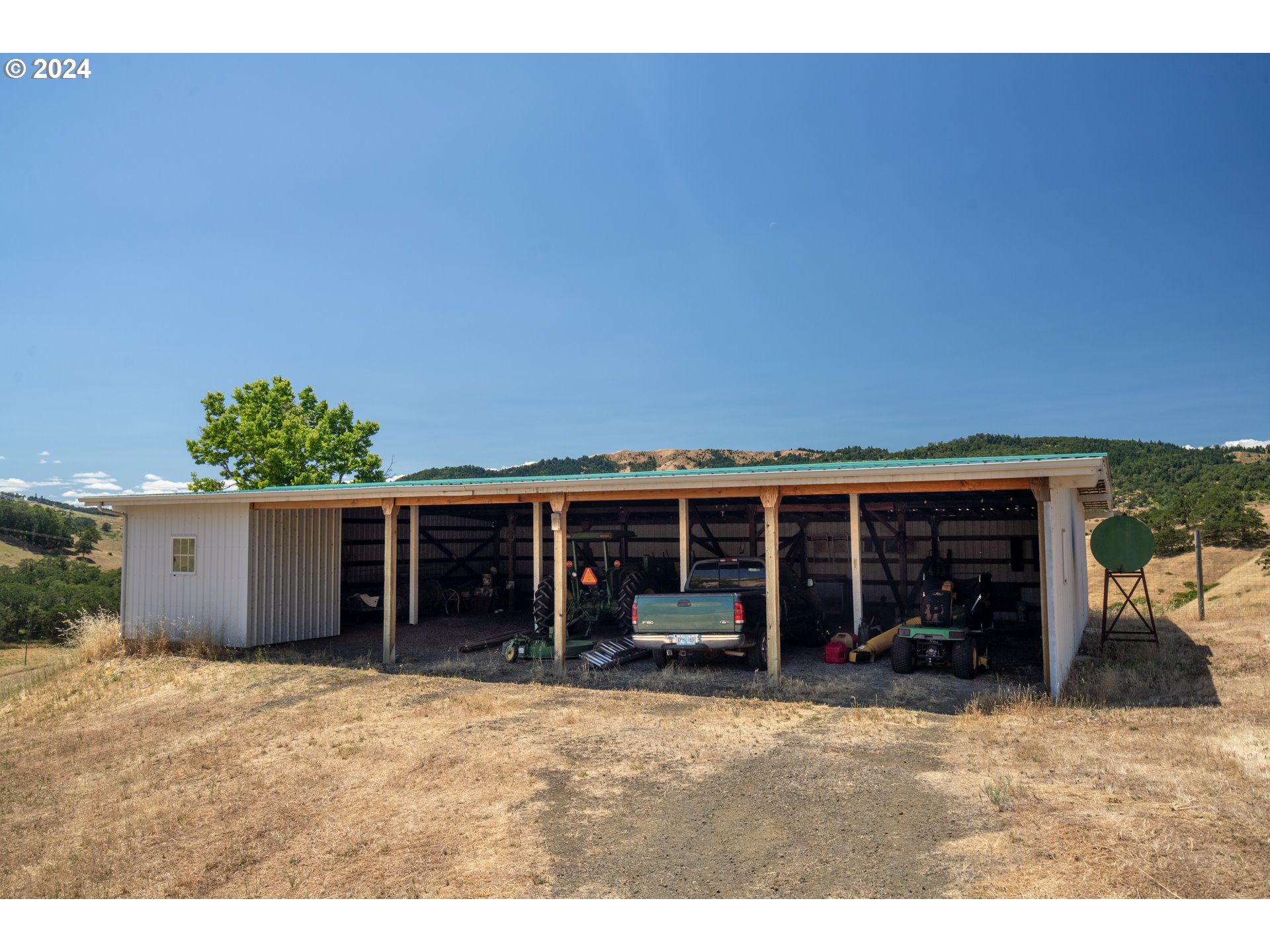 588 South Deer Creek Road Roseburg, OR 97470 - Photo 38 of 45 a view of a house with a backyard and a potted plant