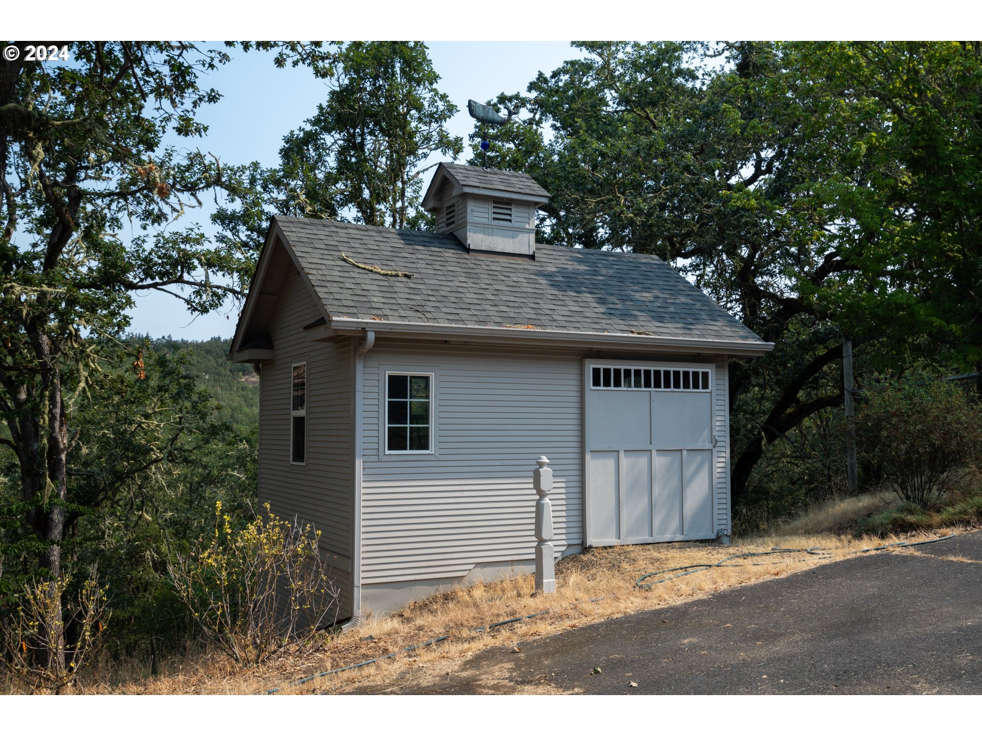 588 South Deer Creek Road Roseburg, OR 97470 - Photo 39 of 45 a front view of a house with a garden