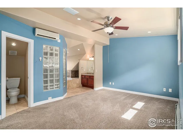 a view of an empty room with a bathroom