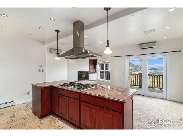 a kitchen with stainless steel appliances granite countertop a stove a sink and a wooden cabinets