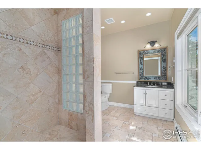 a bathroom with a sink a mirror and a shower