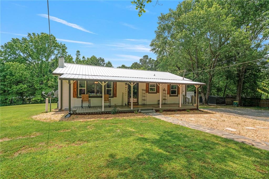 562 Mullinax Road Jasper, GA 30143 - Photo 1 of 1 a view of a house with a yard