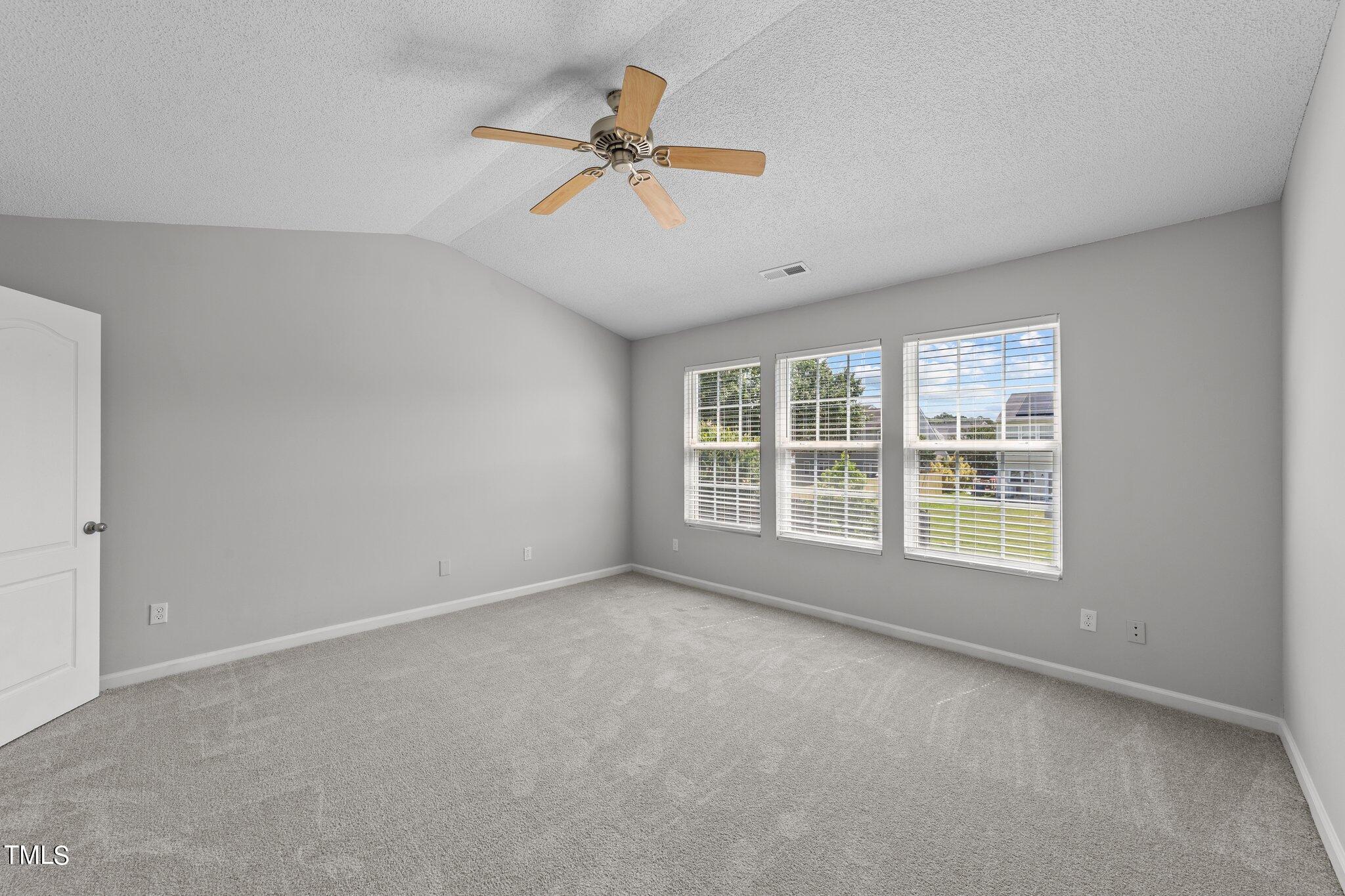 2909 Hayling Drive Raleigh, NC 27610 - Photo 20 of 35 a view of an empty room with a window