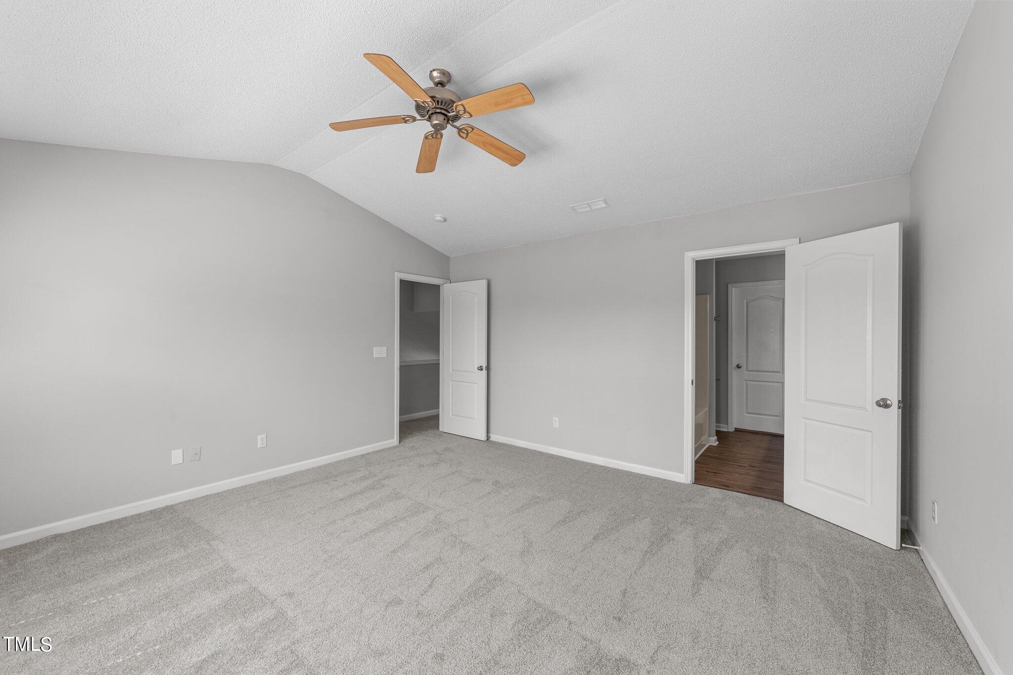 2909 Hayling Drive Raleigh, NC 27610 - Photo 21 of 35 a view of an empty room and chandelier fan