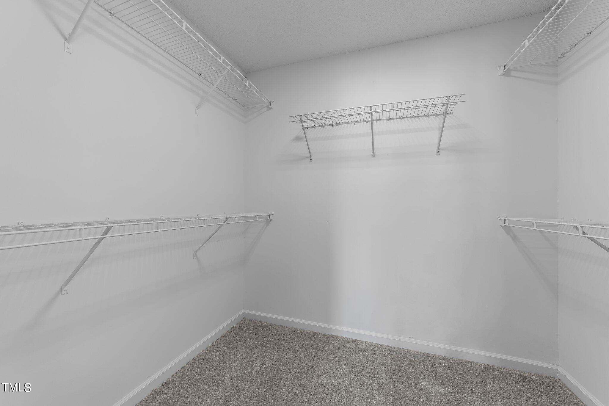 2909 Hayling Drive Raleigh, NC 27610 - Photo 24 of 35 a view of a room with racks on the wall