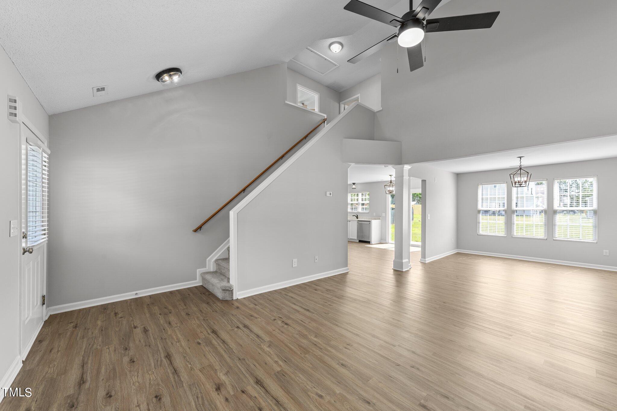 2909 Hayling Drive Raleigh, NC 27610 - Photo 3 of 35 wooden floor in an empty room with a window